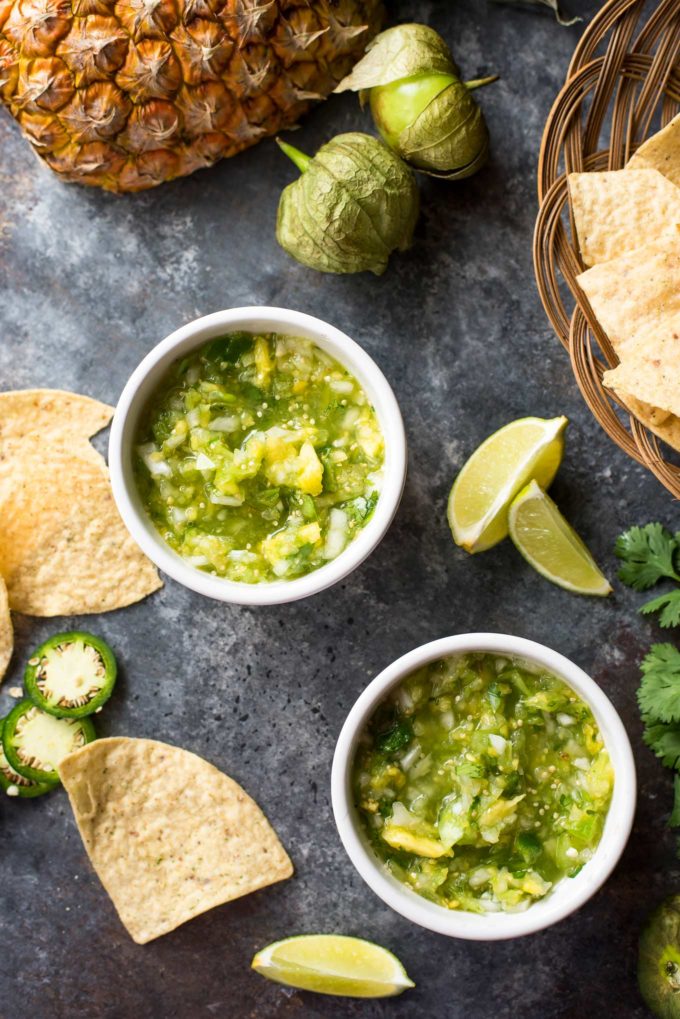 Two white bowls of tomatillo salsa