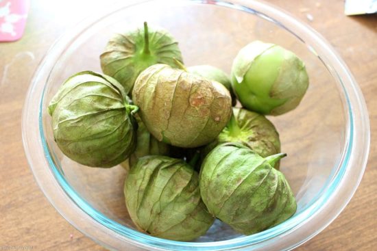 glass bowl of tomatillos