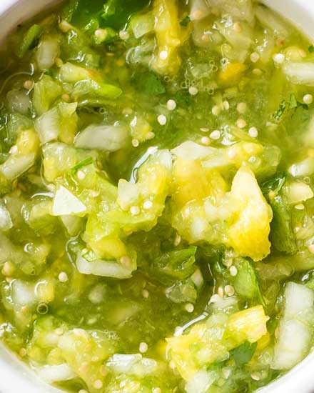 This copycat of Abuelo's tomatillo lime salsa is so close, you'll think you're actually at the restaurant!  Bright, fresh, and ready in 5 minutes! #salsa #tomatillo #lime #copycat #abuelos #greensalsa #easyrecipe #Mexican #copycatrecipe