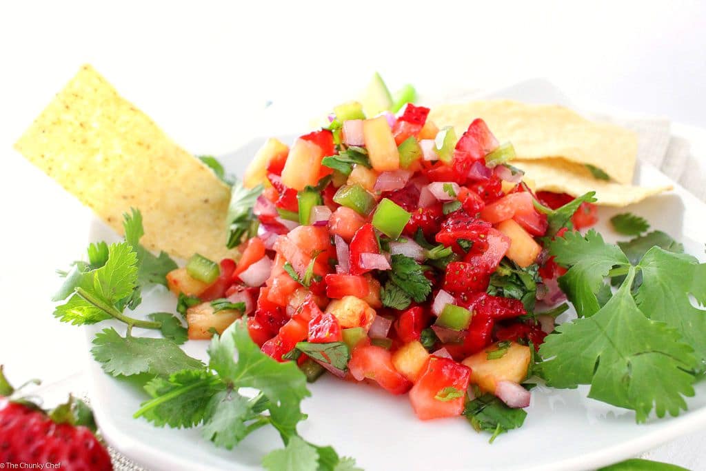 The Chunky Chef | Strawberry Jalapeno and Pineapple Salsa: Fresh, summery, and tasty!  This strawberry jalapeno and pineapple salsa is perfect with crisp tortilla chips, or as a topper for some grilled chicken.