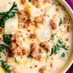 The BEST copycat zuppa toscana soup, made with spicy crumbled sausage, silky potatoes, and an ultra creamy broth.  Bacon and kale put the finishing touch on this Olive Garden copycat recipe! #soup #souprecipe #copycat #zuppatoscana #olivegarden #slowcooker #crockpot #instantpot #pressurecooker #easyrecipe #weeknightmeal