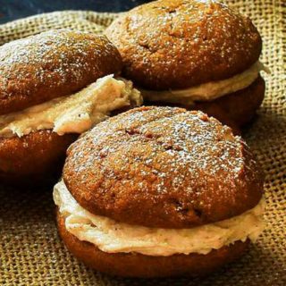 Soft and light spiced pumpkin cookies sandwiched together with a decadent, yet easy to make, browned butter maple cinnamon frosting! #fallbaking #baking #cookies #whoopiepies #pumpkin #pumpkinspice #maple