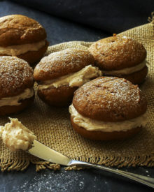 Spiced Pumpkin Whoopie Pies | The Chunky Chef | Soft and light spiced pumpkin cookies sandwiched together with a decadent, yet easy to make, browned butter maple cinnamon frosting!