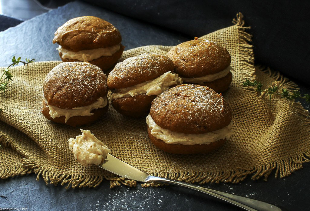 Spiced Pumpkin Whoopie Pies | The Chunky Chef | Soft and light spiced pumpkin cookies sandwiched together with a decadent, yet easy to make, browned butter maple cinnamon frosting!