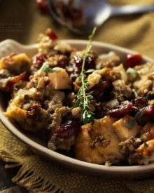 Harvest Apple Cranberry and Sage Sausage Stuffing | The ultimate sausage stuffing recipe for Thanksgiving! All your favorite Fall flavors are baked together in a perfectly textured side dish you'll love!