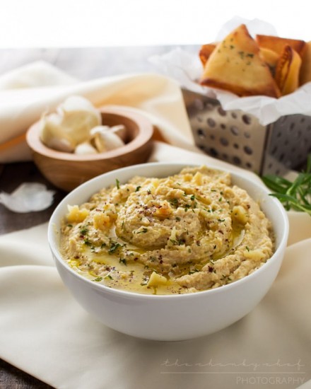 Roasted Garlic Hummus | The Chunky Chef | Creamy, rich hummus with a deep, slightly sweet roasted garlic flavor. Whip it up in the food processor and enjoy it with some crispy pita chips or naan!