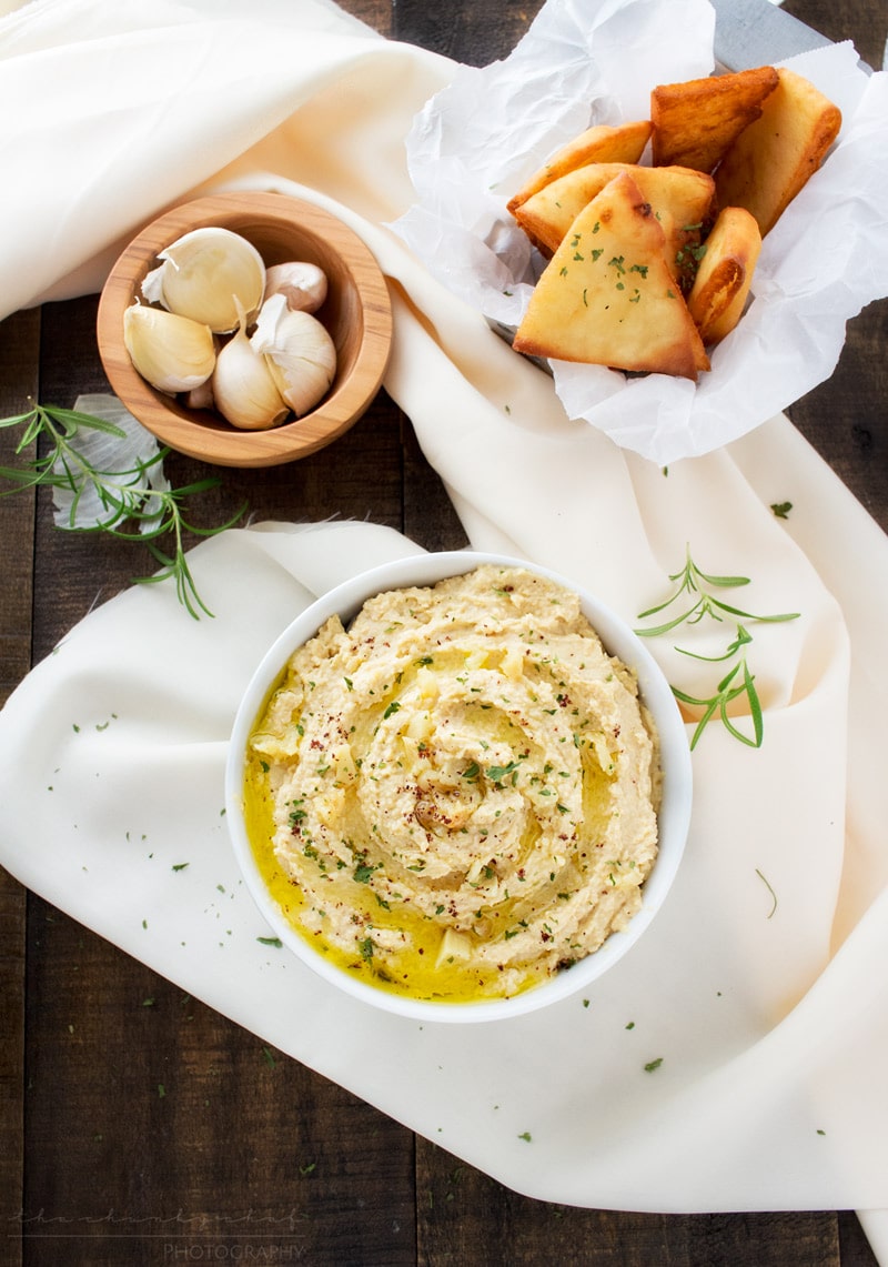 Roasted Garlic Hummus | The Chunky Chef | Creamy, rich hummus with a deep, slightly sweet roasted garlic flavor. Whip it up in the food processor and enjoy it with some crispy pita chips or naan!