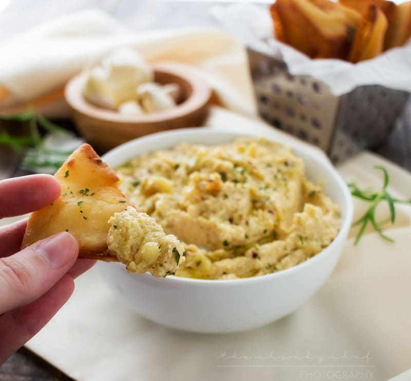 Roasted Garlic Hummus | The Chunky Chef | Creamy, rich hummus with a deep, slightly sweet roasted garlic flavor. Whip it up in the food processor and enjoy it with some crispy pita chips or naan!