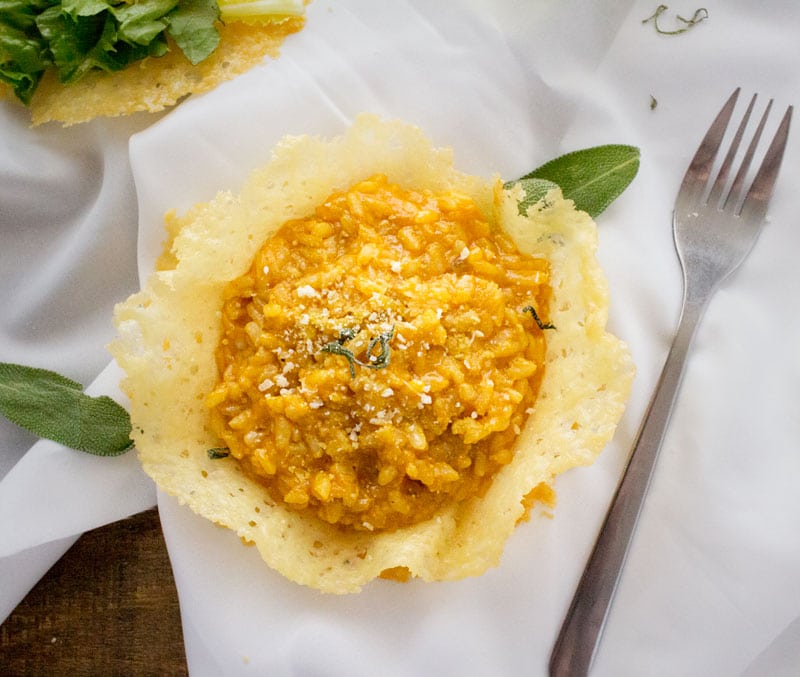 Pumpkin Risotto in Parmesan Bowls | Classic Fall flavors come together in this ultra creamy pumpkin risotto topped with fresh sage and a sprinkle of Parmesan... served in edible bowls!!