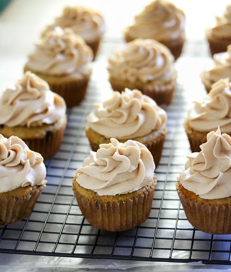 Banana Cupcakes | Unbelievably soft banana cupcakes are frosted with a creamy peanut butter cream cheese frosting that's kissed with honey, and drizzled with chocolate!