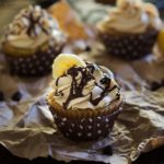 Banana Cupcakes | Unbelievably soft banana cupcakes are frosted with a creamy peanut butter cream cheese frosting that's kissed with honey, and drizzled with chocolate!