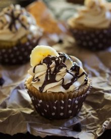 Banana Cupcakes | Unbelievably soft banana cupcakes are frosted with a creamy peanut butter cream cheese frosting that's kissed with honey, and drizzled with chocolate!