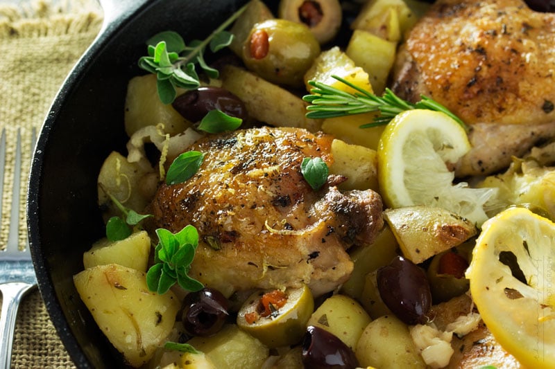 One Pan Mediterranean Braised Chicken | Fall in love with Mediterranean flavors with this easy and delicious one pan, one hour, braised chicken with creamy potatoes, roasted olives, bright lemon and fresh herbs! 