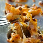 Cheesy One Bite Baked Penne Cups | Creamy, cheesy and spicy baked penne pasta is baked into mini muffin cups for the tastiest appetizer around! They're the perfect one-bite snack!