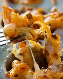 Cheesy One Bite Baked Penne Cups | Creamy, cheesy and spicy baked penne pasta is baked into mini muffin cups for the tastiest appetizer around! They're the perfect one-bite snack!