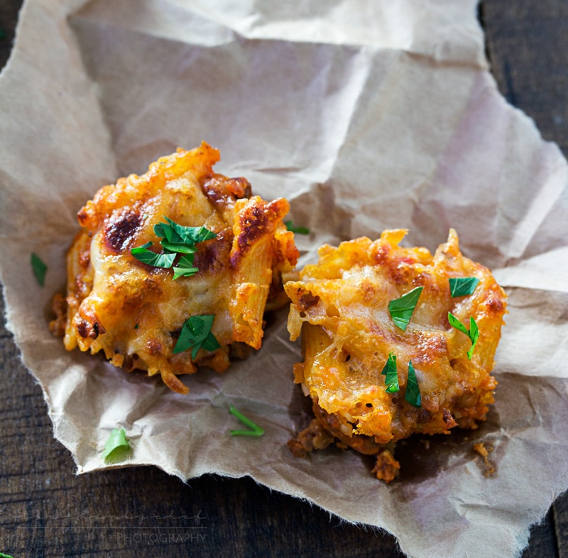 Cheesy One Bite Baked Penne Cups | Creamy, cheesy and spicy baked penne pasta is baked into mini muffin cups for the tastiest appetizer around! They're the perfect one-bite snack!