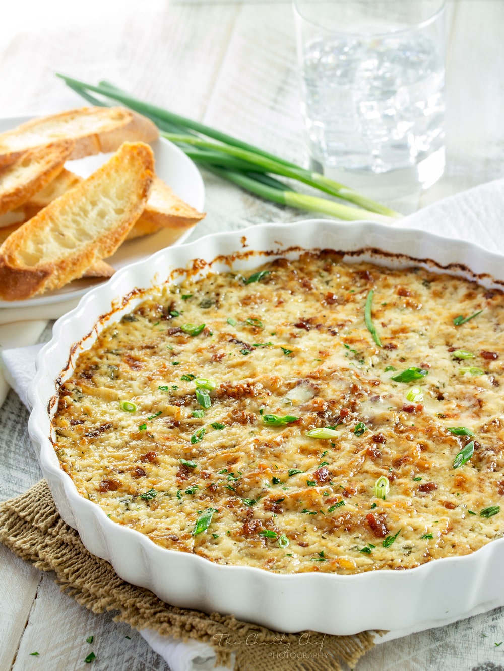 Caramelized Onion Dip | The ultimate party dip! This onion dip is made with gruyere, white cheddar, herbs, bacon, and rich caramelized onions for a melt in your mouth appetizer! | http://thechunkychef.com