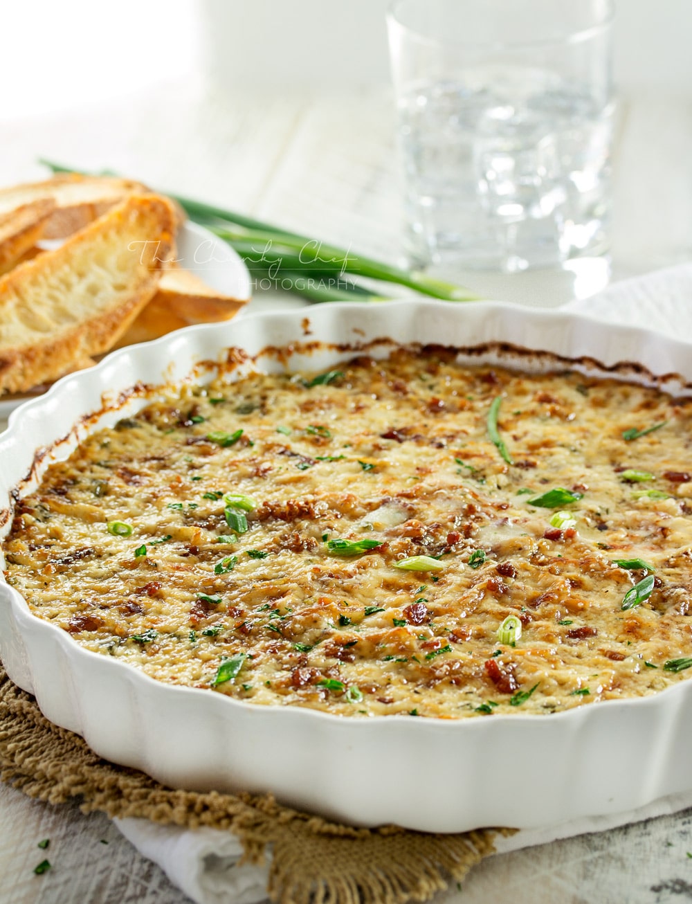 Caramelized Onion Dip | The ultimate party dip! This onion dip is made with gruyere, white cheddar, herbs, bacon, and rich caramelized onions for a melt in your mouth appetizer! | http://thechunkychef.com