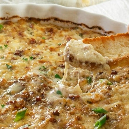 Caramelized Onion Dip | The ultimate party dip! This onion dip is made with gruyere, white cheddar, herbs, bacon, and rich caramelized onions for a melt in your mouth appetizer! | http://thechunkychef.com