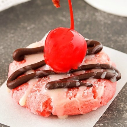 Glazed Chocolate Cherry Cookies | Soft and buttery cherry cookies, made with cherry juice and cherry pieces, are topped with a drizzle of melted chocolate, sweet glaze, and a cherry! | http://thechunkychef.com