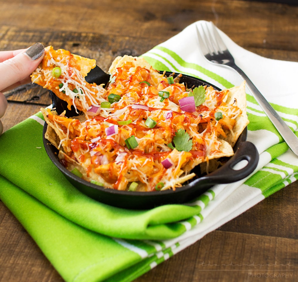 Oven Baked BBQ Chicken Pizza Nachos | Oven baked BBQ chicken pizza nachos... the awesome combination of homemade bbq sauce, juicy chicken, gooey cheese and tons of toppings! | http://thechunkychef.com