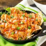 Oven Baked BBQ Chicken Pizza Nachos | Oven baked BBQ chicken pizza nachos... the awesome combination of homemade bbq sauce, juicy chicken, gooey cheese and tons of toppings! | http://thechunkychef.com