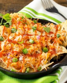 Oven Baked BBQ Chicken Pizza Nachos | Oven baked BBQ chicken pizza nachos... the awesome combination of homemade bbq sauce, juicy chicken, gooey cheese and tons of toppings! | http://thechunkychef.com