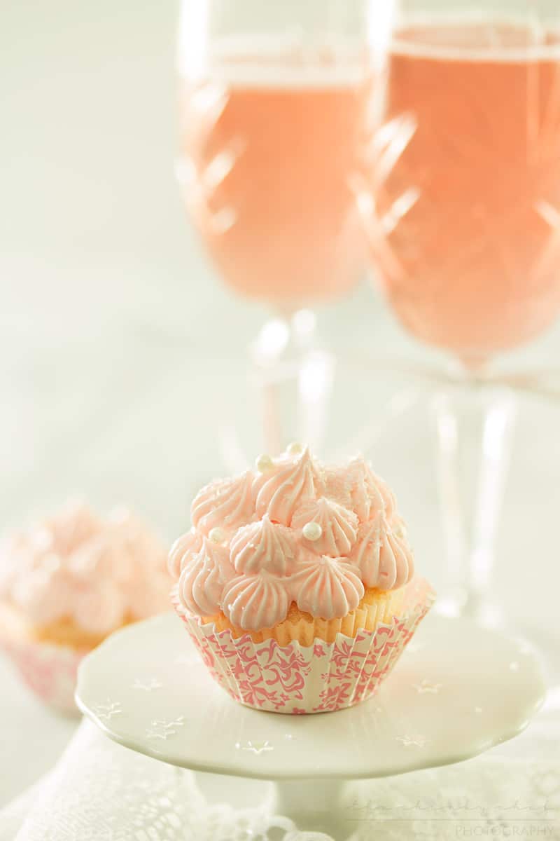 White Chocolate Pink Champagne Cupcakes | Soft, fluffy, white chocolate mini champagne cupcakes are topped with a light and creamy pink champagne buttercream frosting for the perfect treat!! | http://thechunkychef.com