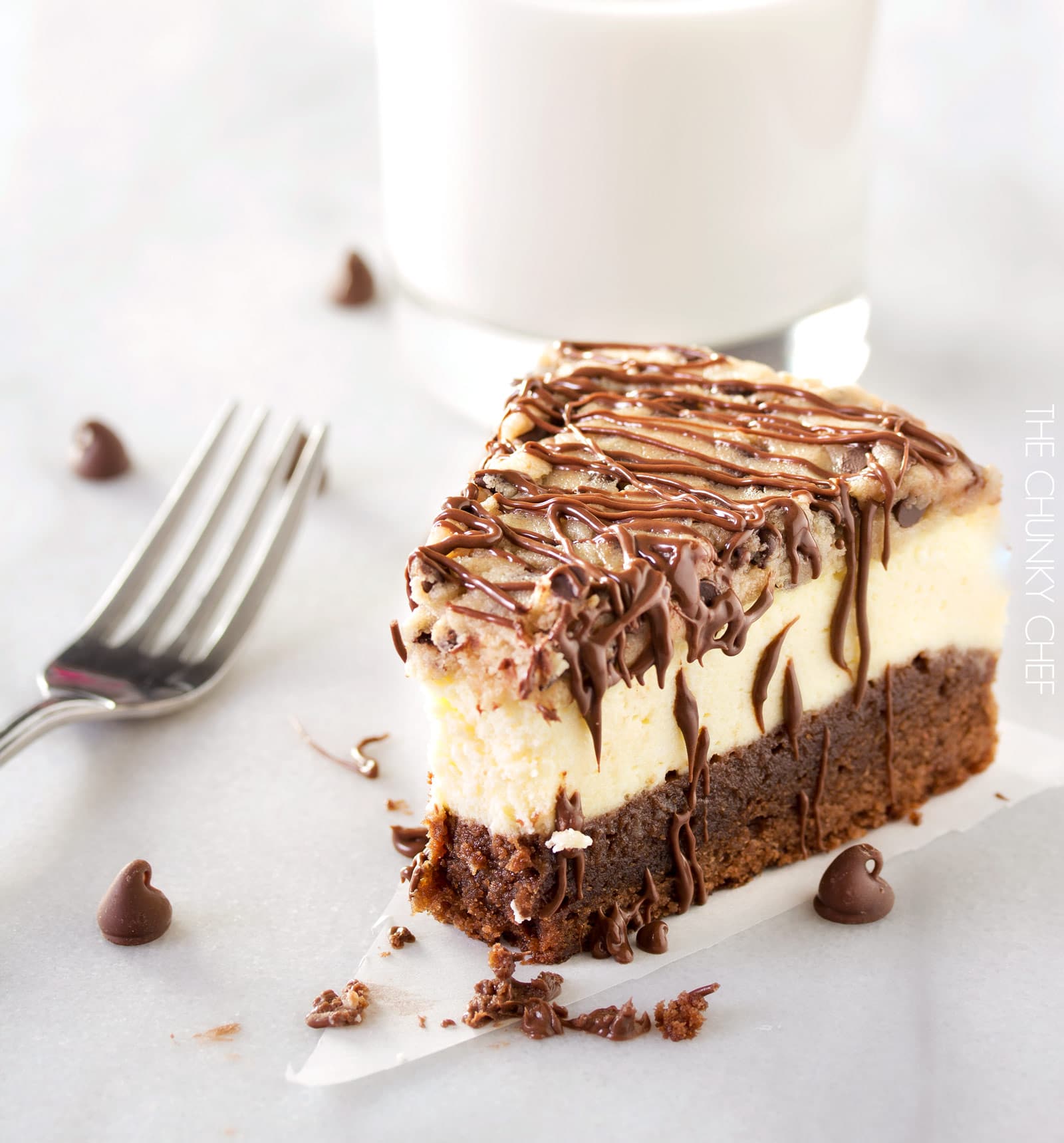 Brownie Bottom Cookie Dough Cheesecake | This impressive, yet super easy, brownie bottom cookie dough cheesecake looks as fancy as any dessert you've had from a restaurant! The ULTIMATE cheesecake for the ULTIMATE dessert lover! | http://thechunkychef.com