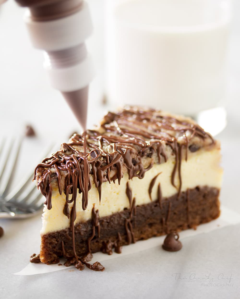 Brownie-Bottom-Cookie-Dough-Cheesecake | This impressive, yet super easy, brownie bottom cookie dough cheesecake looks as fancy as any dessert you've had from a restaurant! The ULTIMATE cheesecake for the ULTIMATE dessert lover! | http://thechunkychef.com