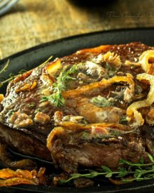 Pan Seared Steak |Tender steak is pan seared and oven roasted to juicy perfection, then topped with a porcini mushroom and herb compound butter and caramelized onions! |http://thechunkychef.com