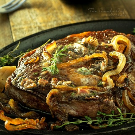 Pan Seared Steak |Tender steak is pan seared and oven roasted to juicy perfection, then topped with a porcini mushroom and herb compound butter and caramelized onions! |http://thechunkychef.com