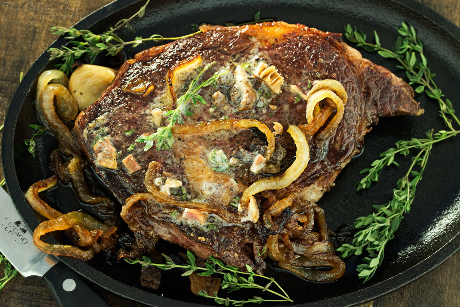 Pan Seared Steak |Tender steak is pan seared and oven roasted to juicy perfection, then topped with a porcini mushroom and herb compound butter and caramelized onions! |http://thechunkychef.com