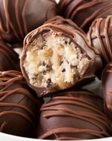 Triple Chocolate Cookie Dough Truffles | These cookie dough truffles are made from an egg-less cookie dough with semi sweet chocolate chips, then coated in two different kinds of chocolate! | http://thechunkychef.com