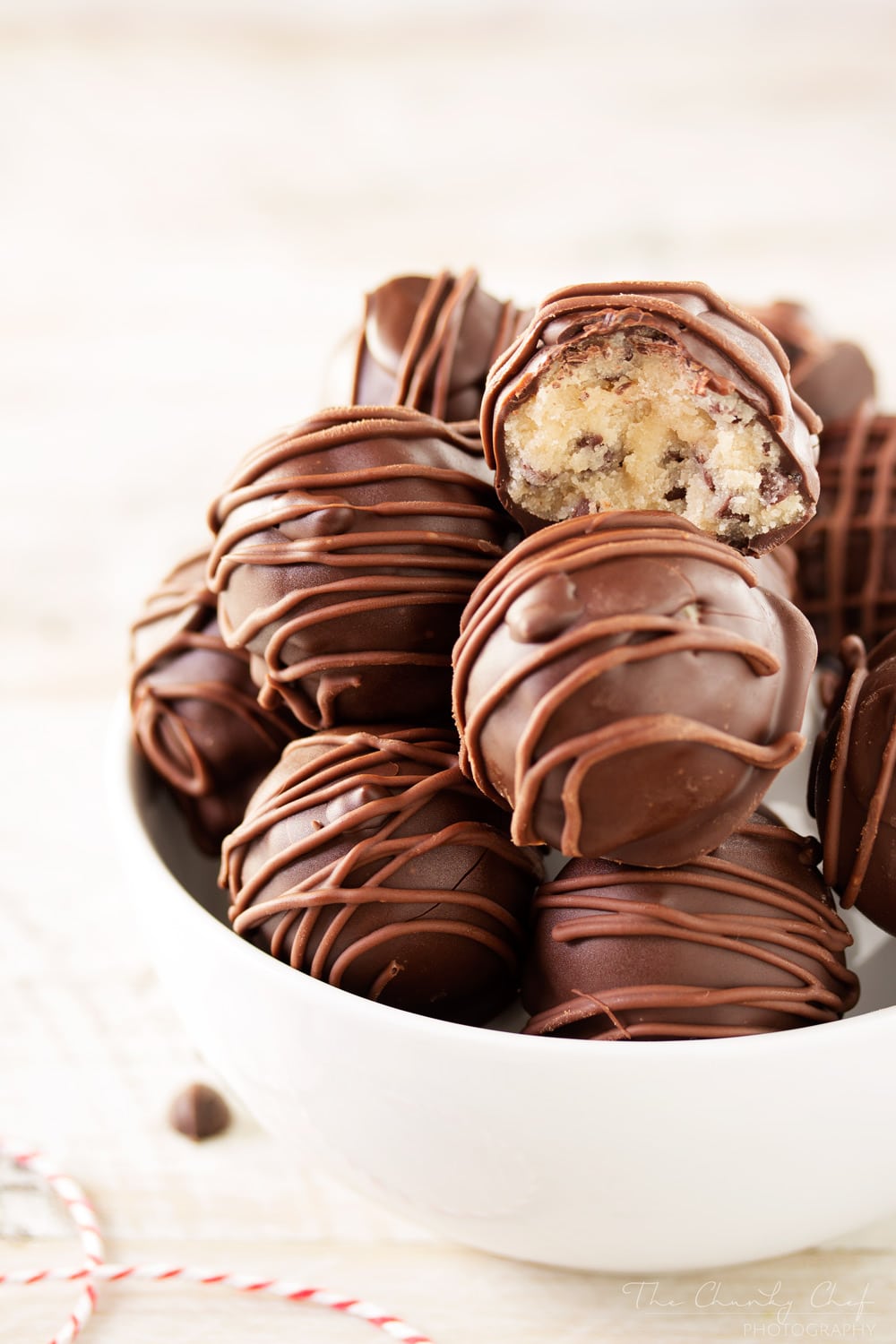 Triple-Chocolate-Cookie-Dough-Truffles | These cookie dough truffles are made from an egg-less cookie dough with semi sweet chocolate chips, then coated in two different kinds of chocolate! | http://thechunkychef.com