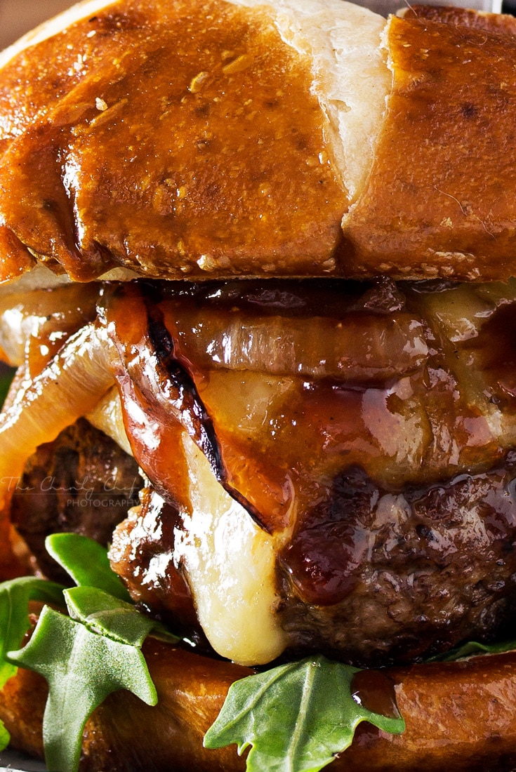 Whiskey-Glazed-Blue-Cheese-Burgers | These blue cheese burgers are brushed with a homemade whiskey glazed, topped with Irish cheese, and smothered in Guinness caramelized onions! | http://thechunkychef.com