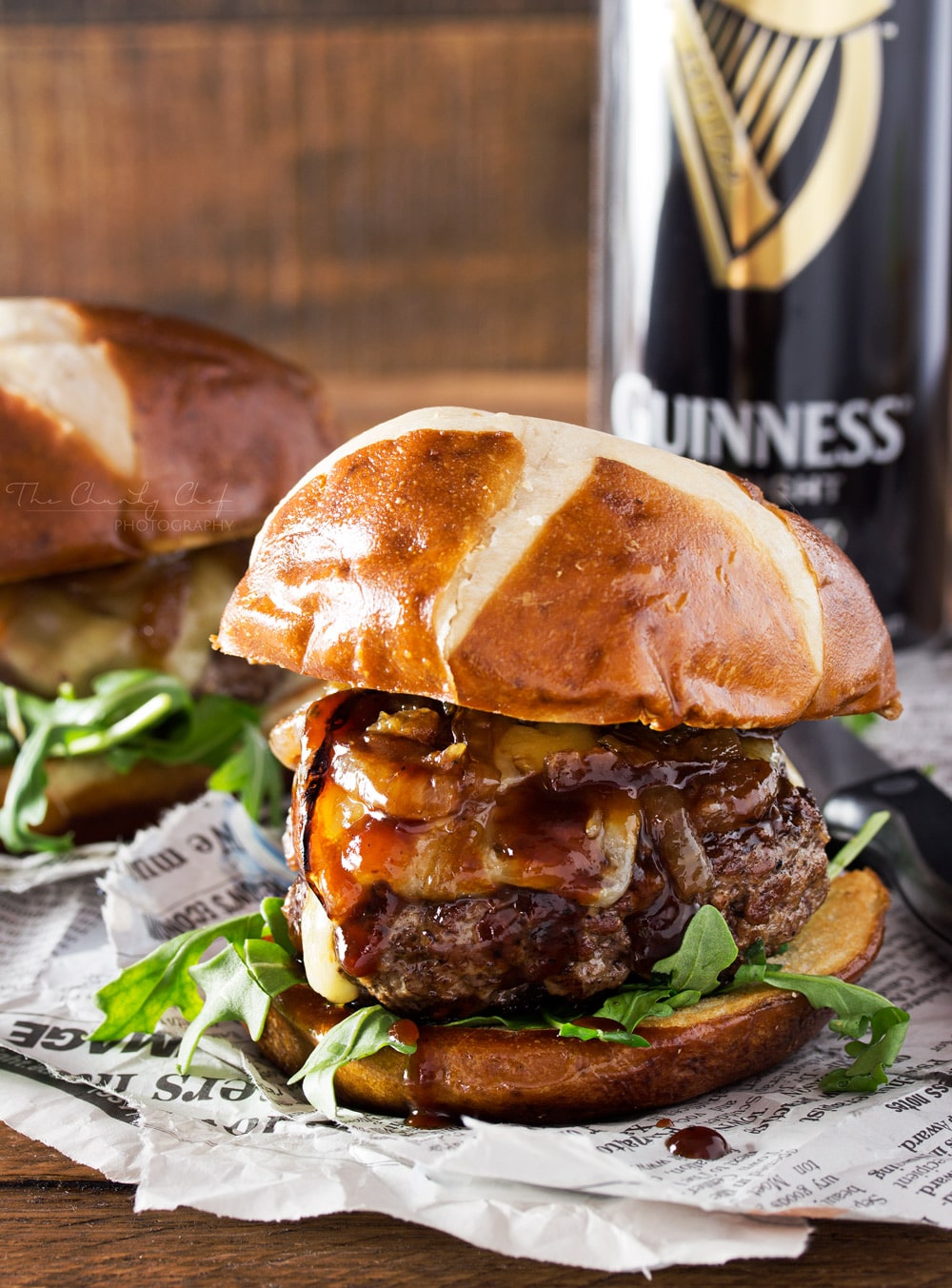 Whiskey-Glazed-Blue-Cheese-Burgers | These blue cheese burgers are brushed with a homemade whiskey glazed, topped with Irish cheese, and smothered in Guinness caramelized onions! | http://thechunkychef.com