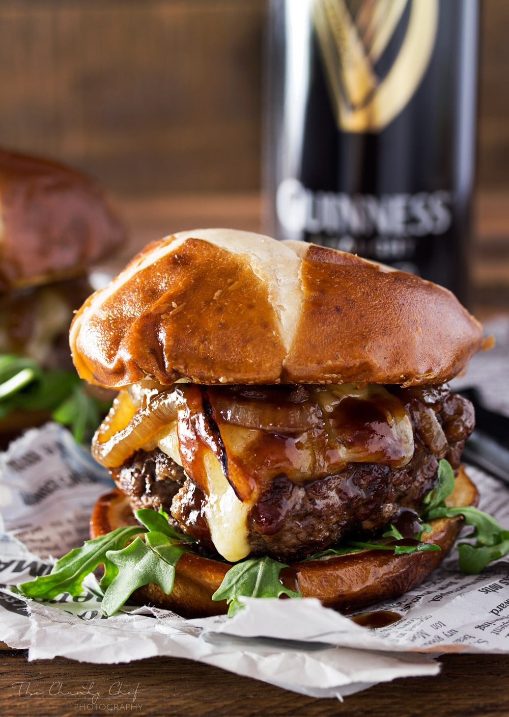 Whiskey-Glazed-Blue-Cheese-Burgers | These blue cheese burgers are brushed with a homemade whiskey glazed, topped with Irish cheese, and smothered in Guinness caramelized onions! | http://thechunkychef.com