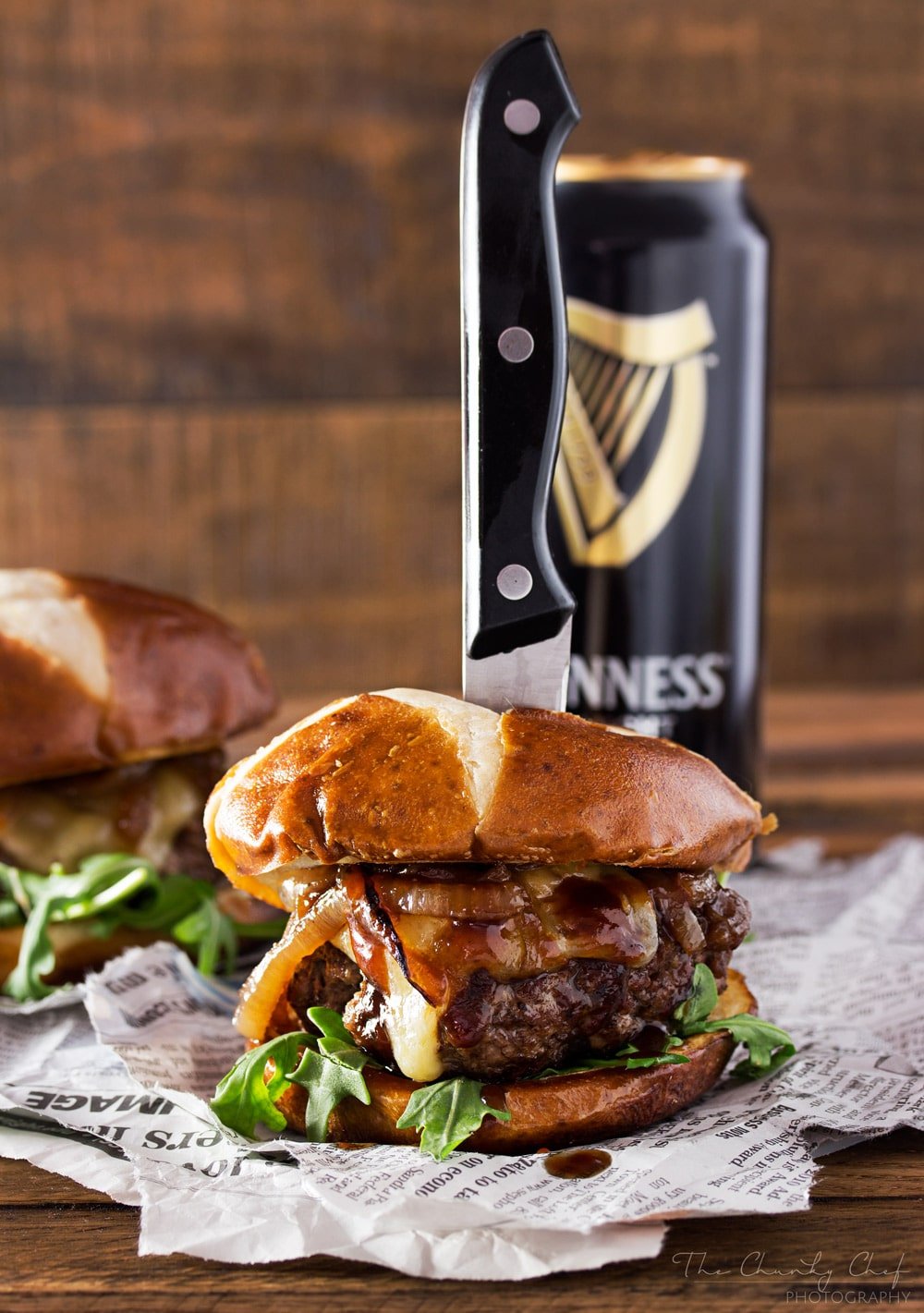 Whiskey-Glazed-Blue-Cheese-Burgers | These blue cheese burgers are brushed with a homemade whiskey glazed, topped with Irish cheese, and smothered in Guinness caramelized onions! | http://thechunkychef.com