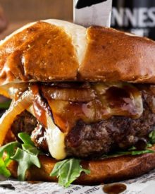 Whiskey-Glazed-Blue-Cheese-Burgers | These blue cheese burgers are brushed with a homemade whiskey glazed, topped with Irish cheese, and smothered in Guinness caramelized onions! | http://thechunkychef.com