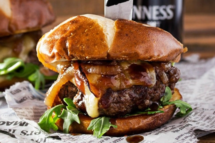 Whiskey-Glazed-Blue-Cheese-Burgers | These blue cheese burgers are brushed with a homemade whiskey glazed, topped with Irish cheese, and smothered in Guinness caramelized onions! | http://thechunkychef.com