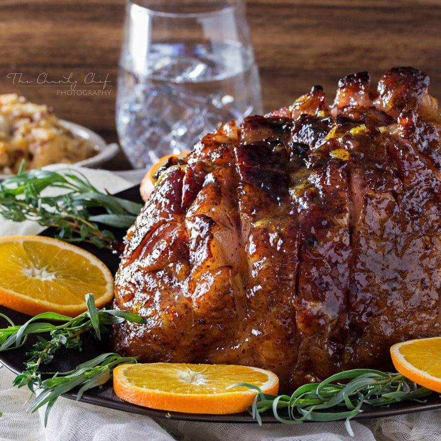 Bourbon Mustard Orange Glazed Ham | Sticky, sweet, tangy, and full of flavor... this bourbon mustard and orange glazed ham is one that you'll be happy to have as the star of your holiday meal! | http://thechunkychef.com