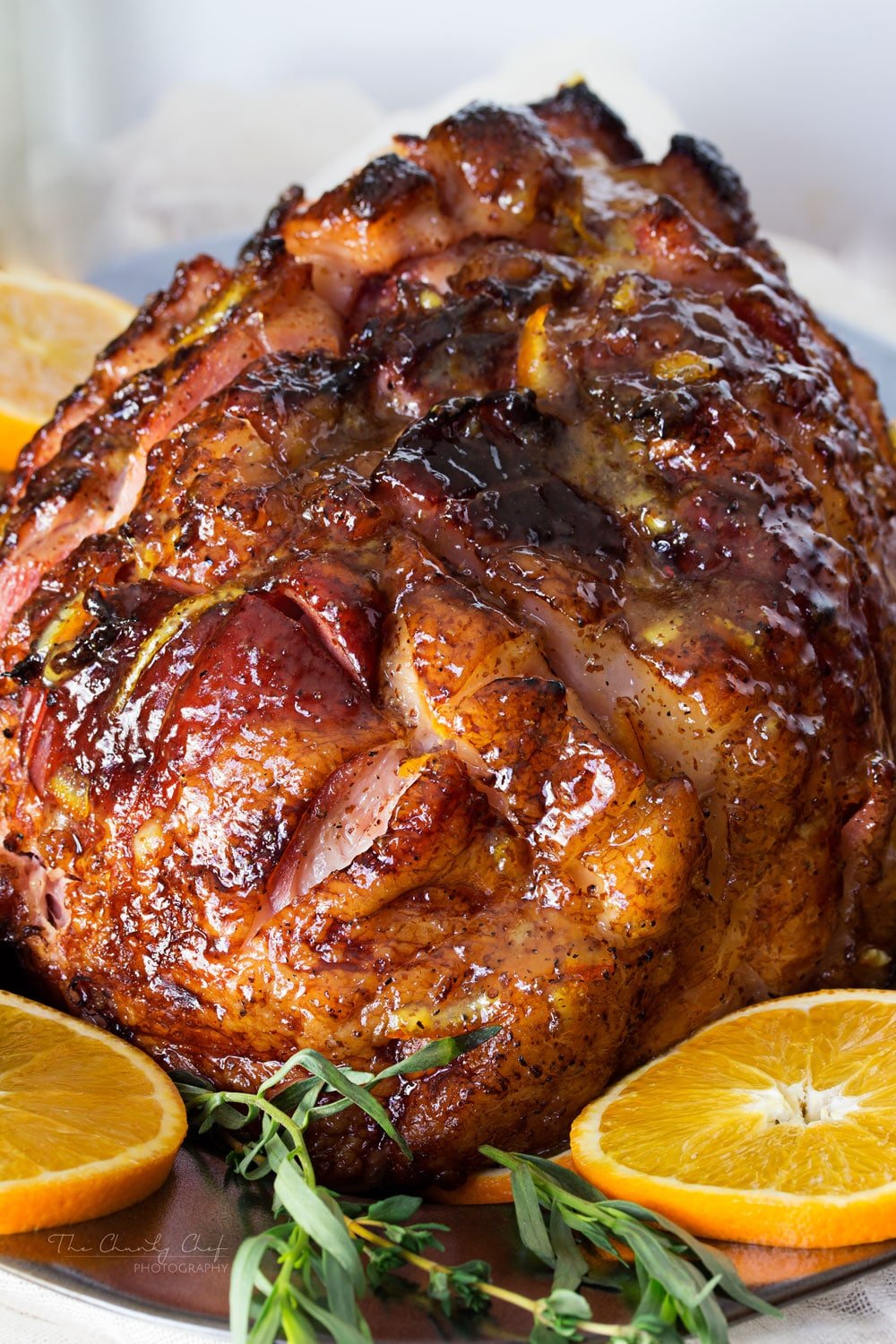 Bourbon Mustard Orange Glazed Ham | Sticky, sweet, tangy, and full of flavor... this bourbon mustard and orange glazed ham is one that you'll be happy to have as the star of your holiday meal! | http://thechunkychef.com