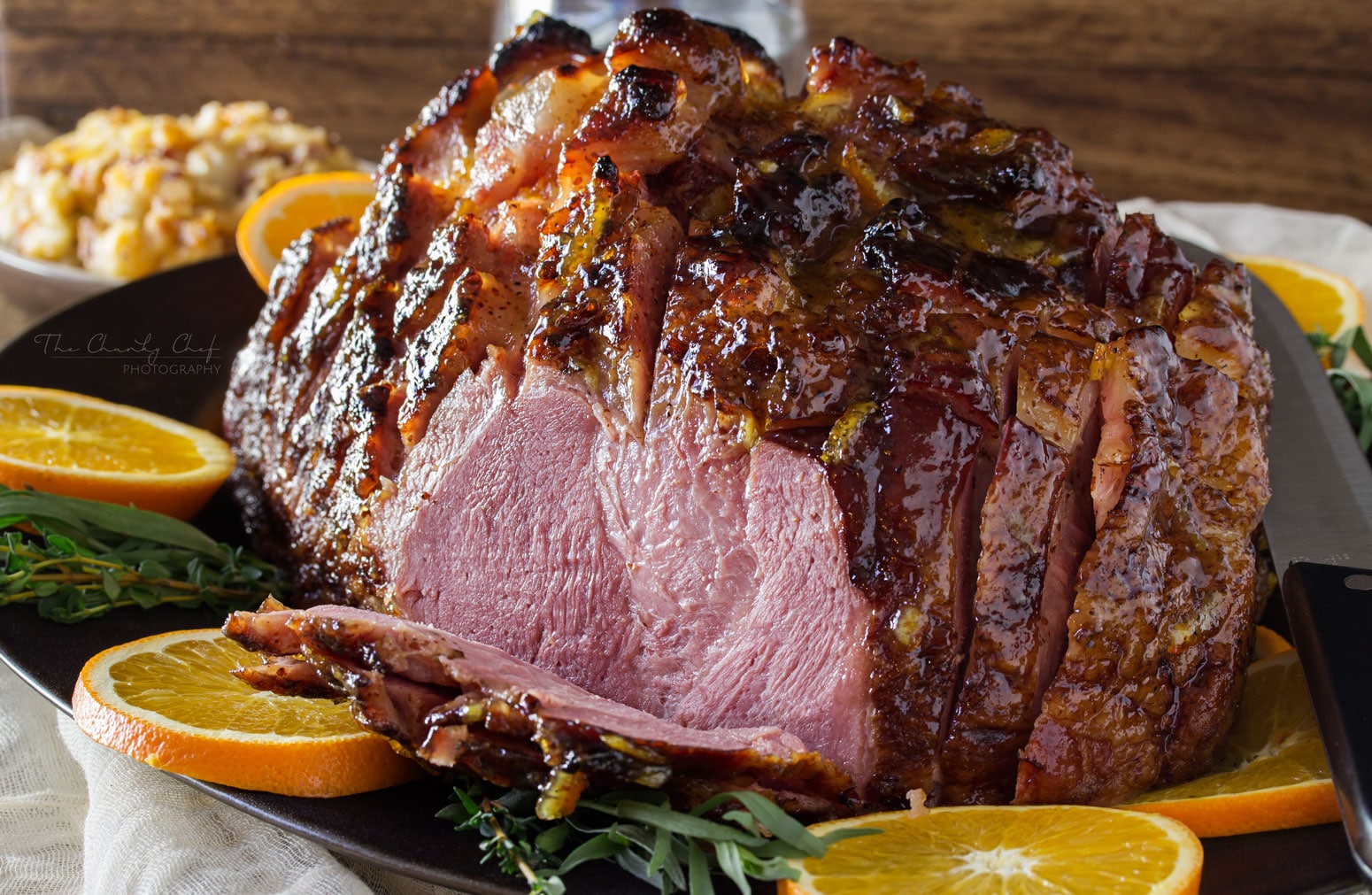 Bourbon Mustard Orange Glazed Ham | Sticky, sweet, tangy, and full of flavor... this bourbon mustard and orange glazed ham is one that you'll be happy to have as the star of your holiday meal! | http://thechunkychef.com