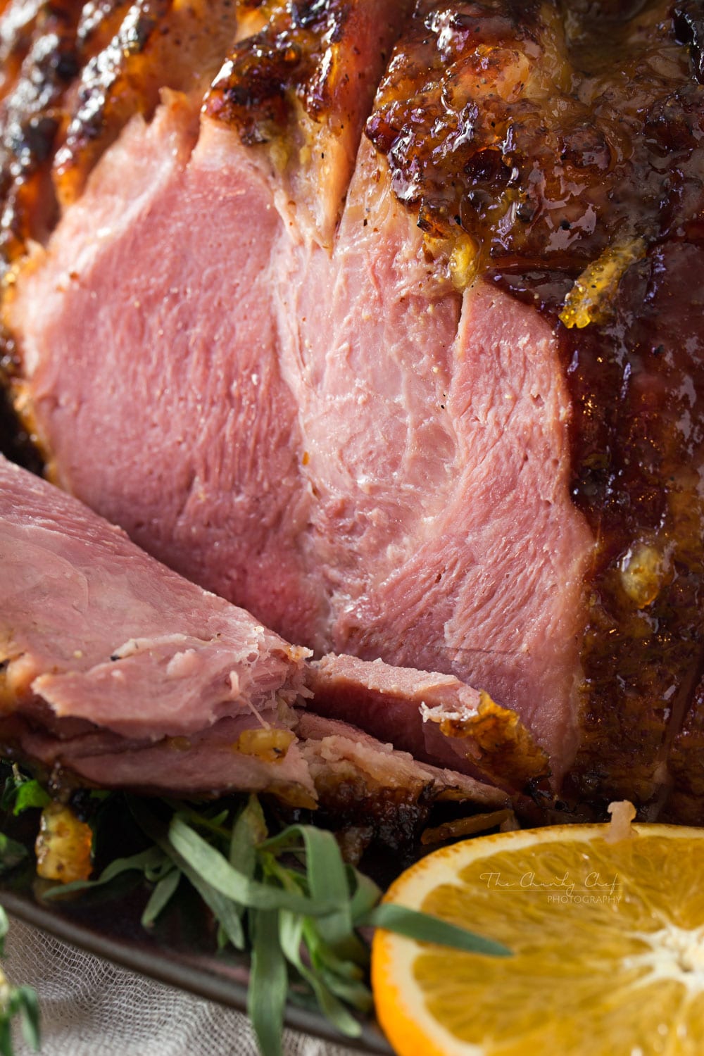Bourbon Mustard Orange Glazed Ham | Sticky, sweet, tangy, and full of flavor... this bourbon mustard and orange glazed ham is one that you'll be happy to have as the star of your holiday meal! | http://thechunkychef.com