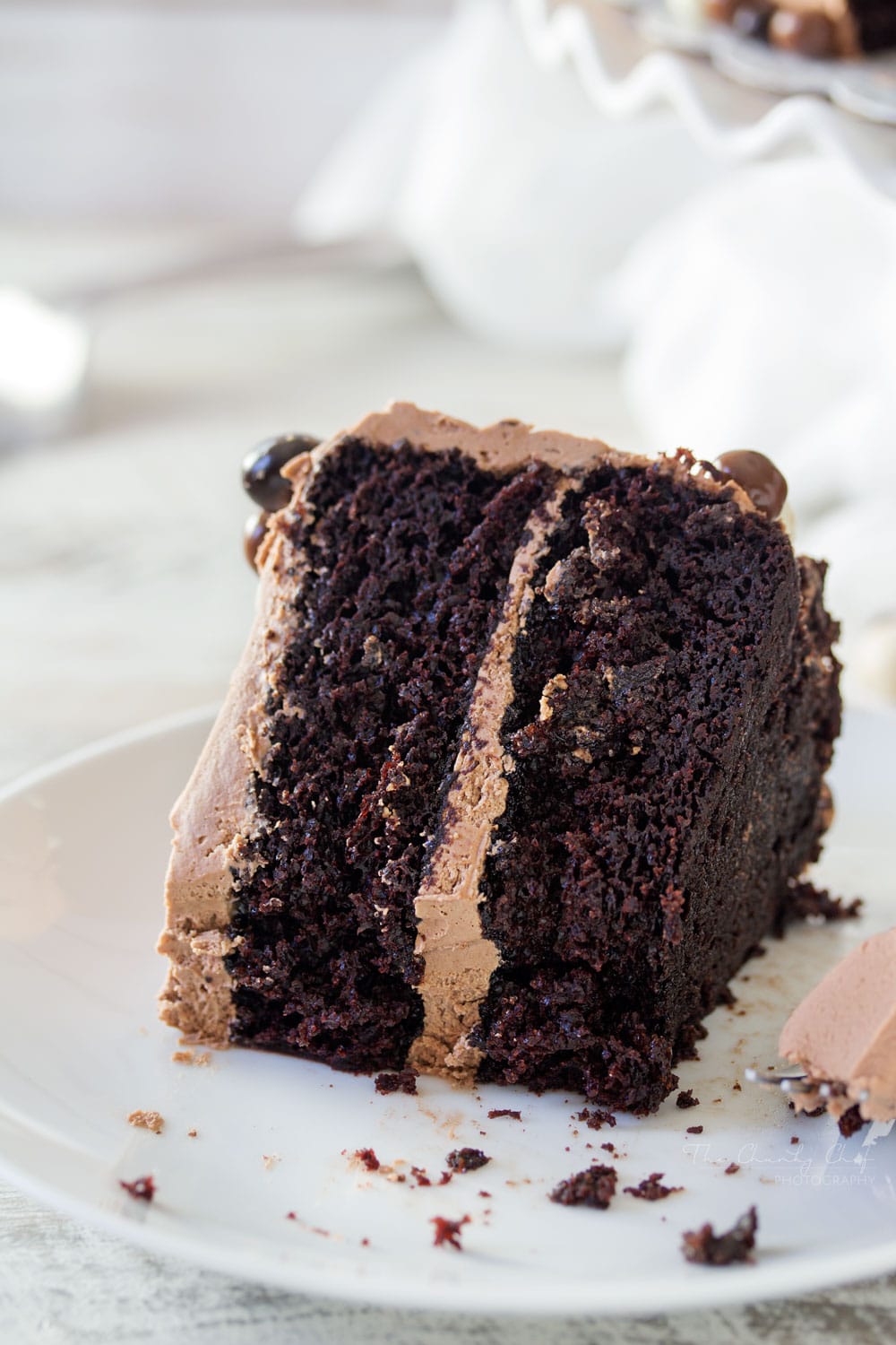 Buttermilk-Chocolate-Layer-Cake | The ULTIMATE soft and fluffy chocolate layer cake. Made from scratch with buttermilk, and slathered in an ultra creamy buttercream frosting! | http://thechunkychef.com