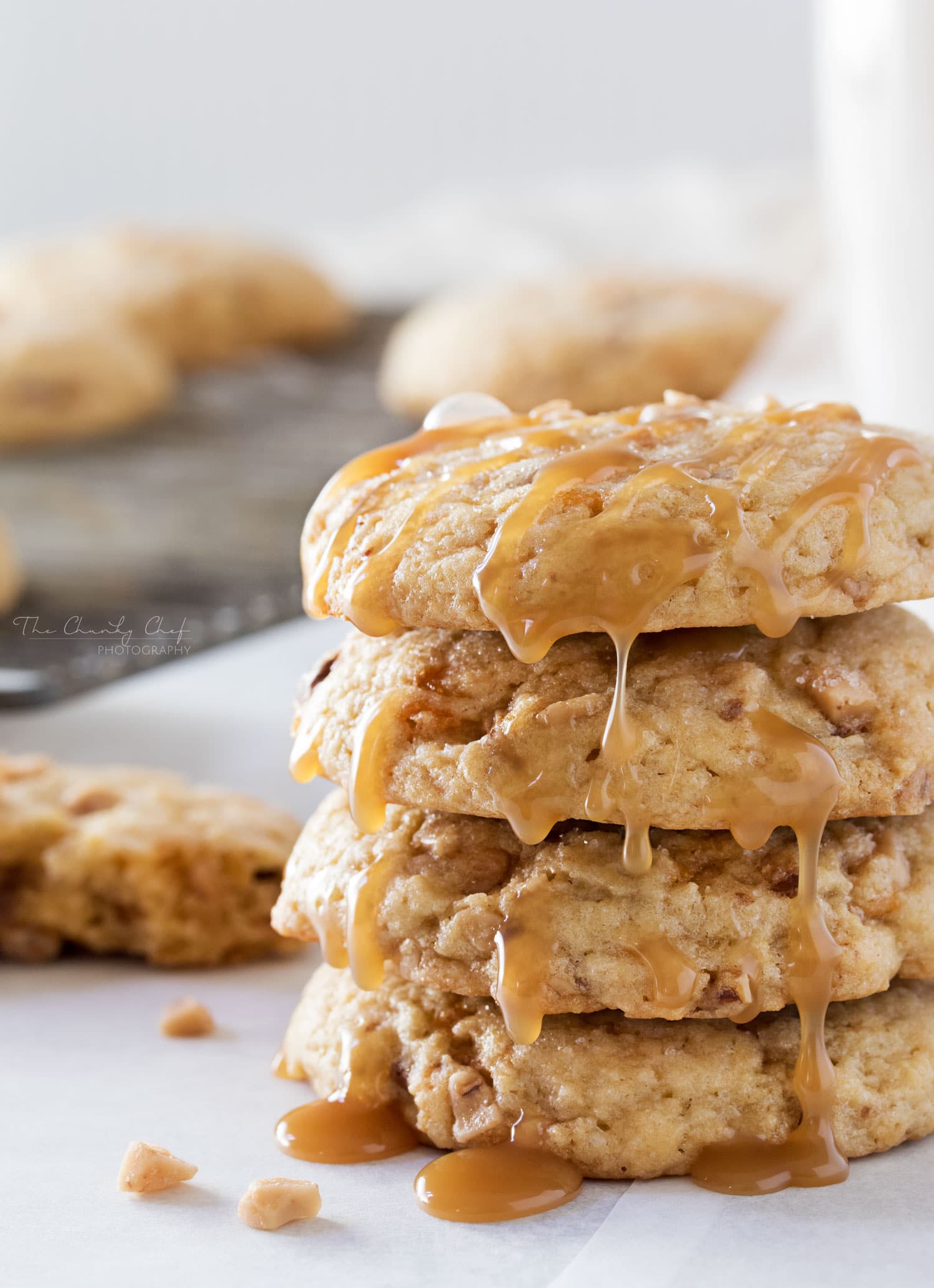 Chewy Butterfinger Toffee Cookies | Soft, chewy and buttery.. these toffee cookies are studded with Butterfinger pieces and chewy bits of toffee. Drizzle them with caramel for extra decadence! | http://thechunkychef.com