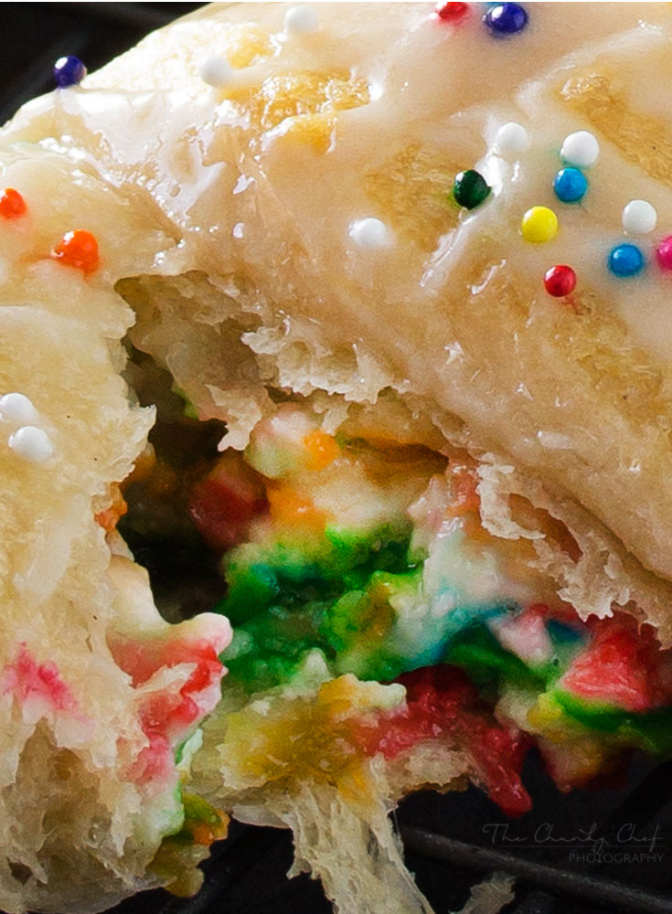 Funfetti-Cheesecake-Stuffed-Crescent-Rolls - Buttery crescent rolls are filled with an easy funfetti cheesecake spread, baked until golden, and drizzled with a vanilla glaze!! Perfect for kids! | http://thechunkychef.com