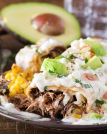 Queso Smothered Beef Barbacoa Chimichangas | Tender, spicy, slow cooked beef barbacoa stuffed into a tortilla and fried to crunchy perfection, then smothered in a velvety smooth white queso! | http://thechunkychef.com