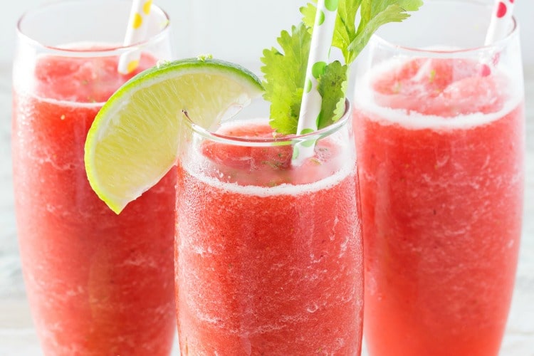 Boozy Strawberry Limeade Slushies | Just 5 ingredients, including ice, and you're on your way to slushy heaven! | http://thechunkychef.com